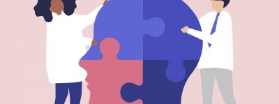 People connecting jigsaw pieces of a head together